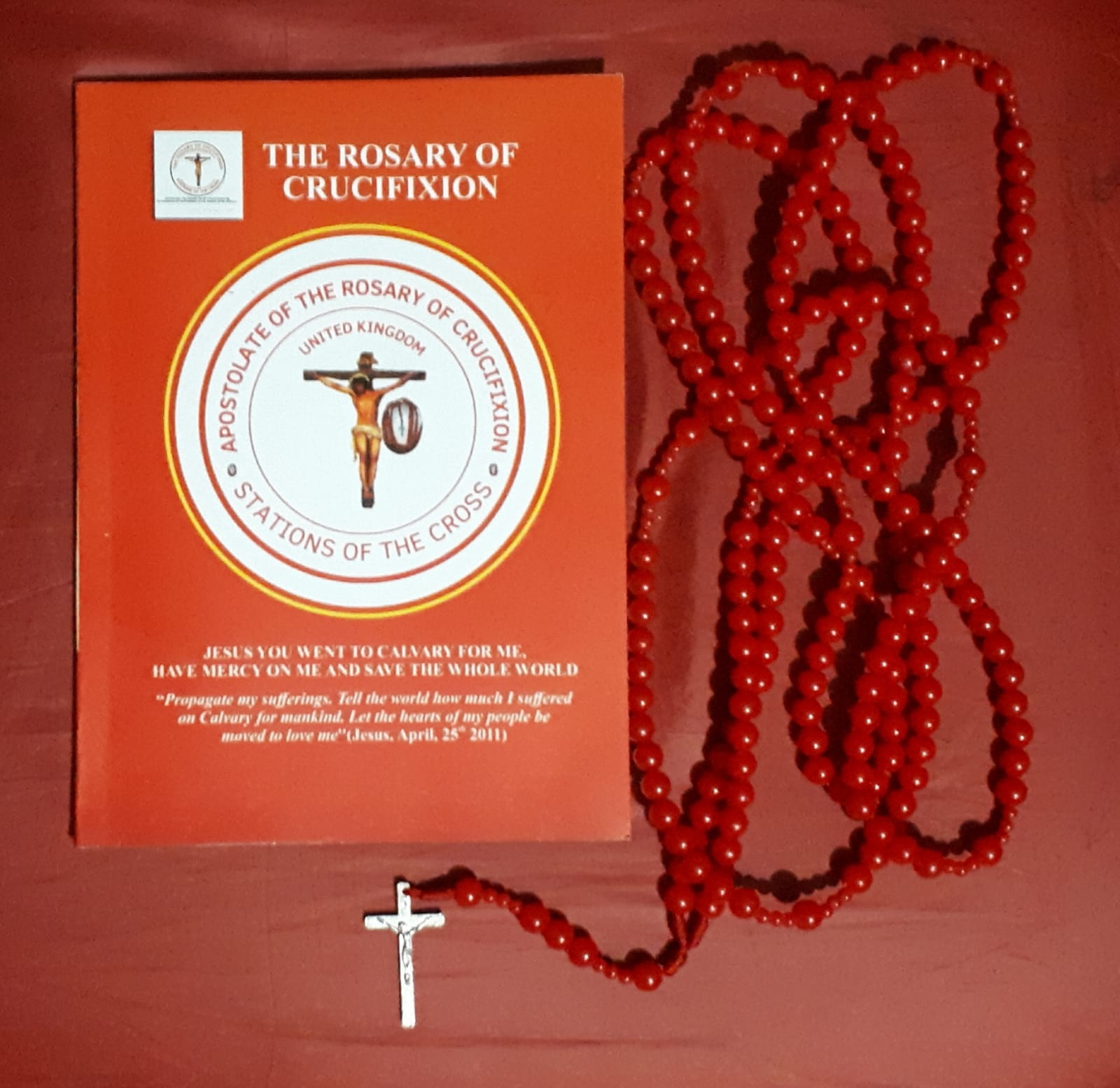 Rosary beads and The Rosary of Crucifixion book