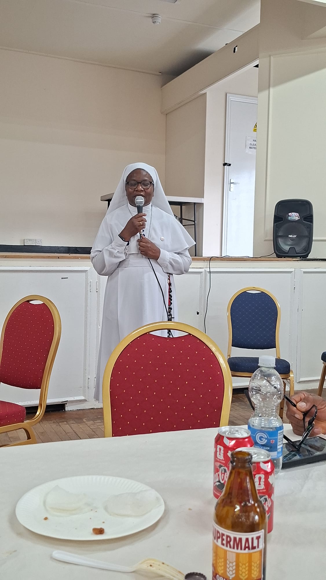 Sister addressing devotees during the consecration gathering