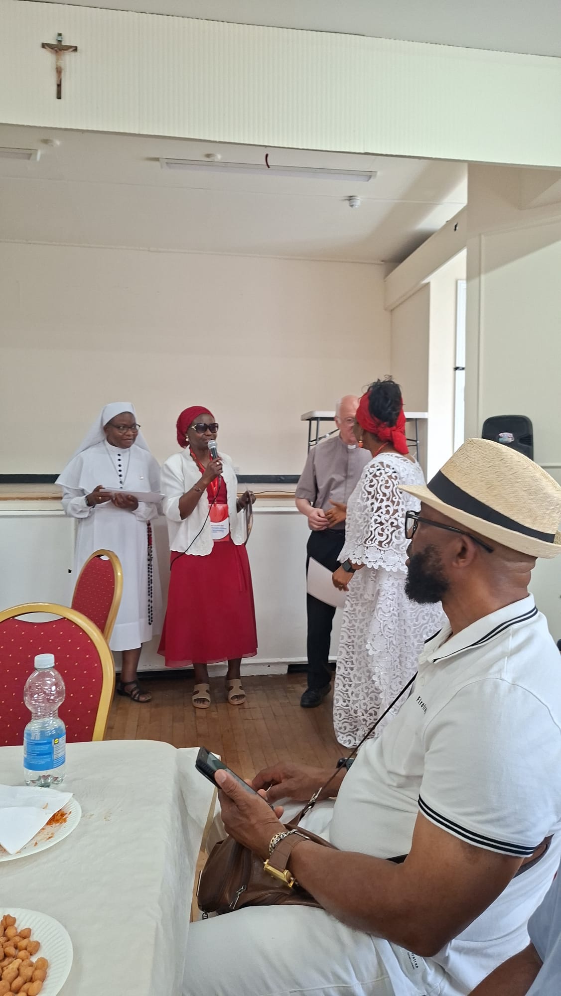 Devotee receiving recognition during the Walthamstow event