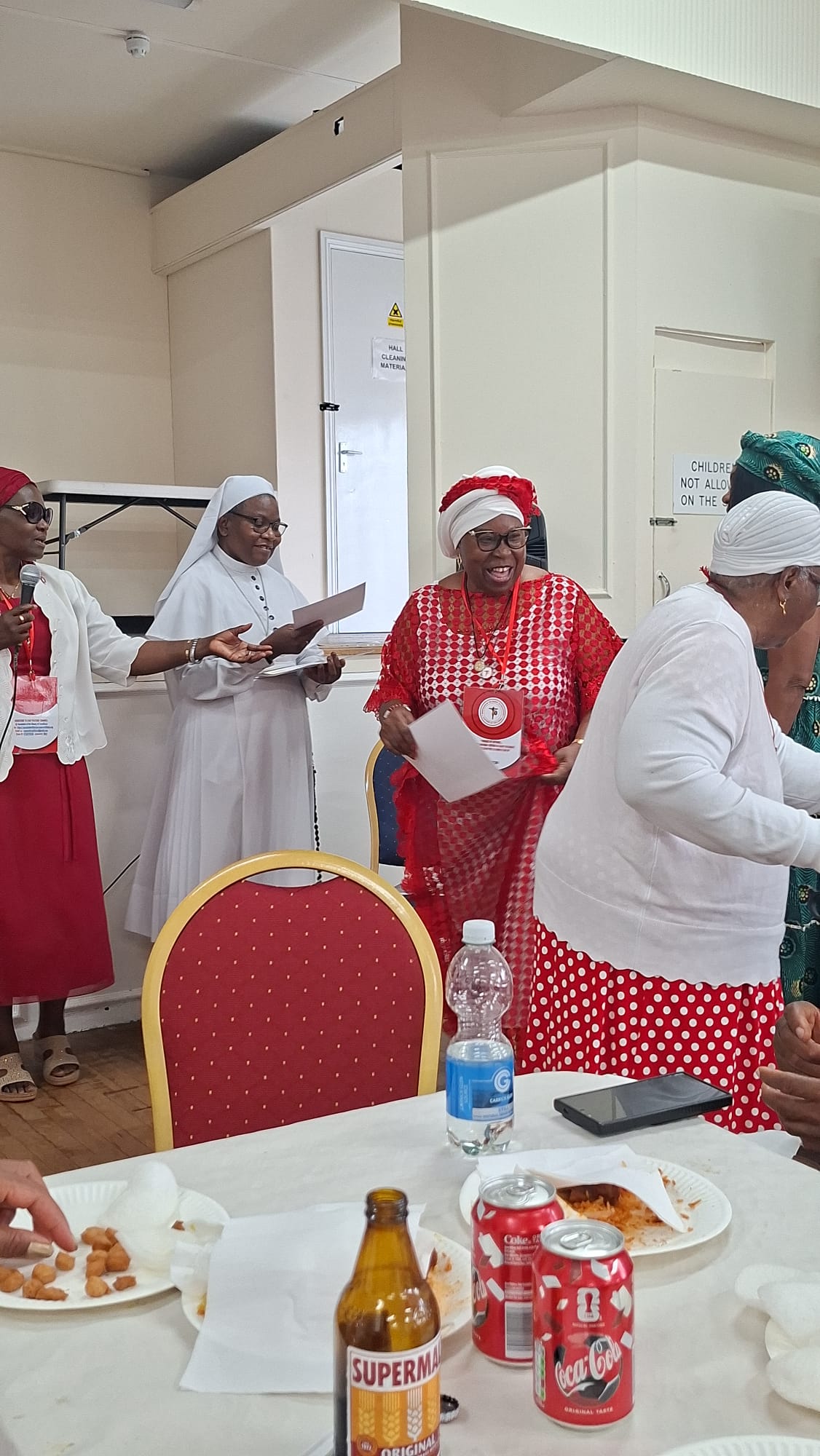 Devotees in red and white at the Walthamstow gathering