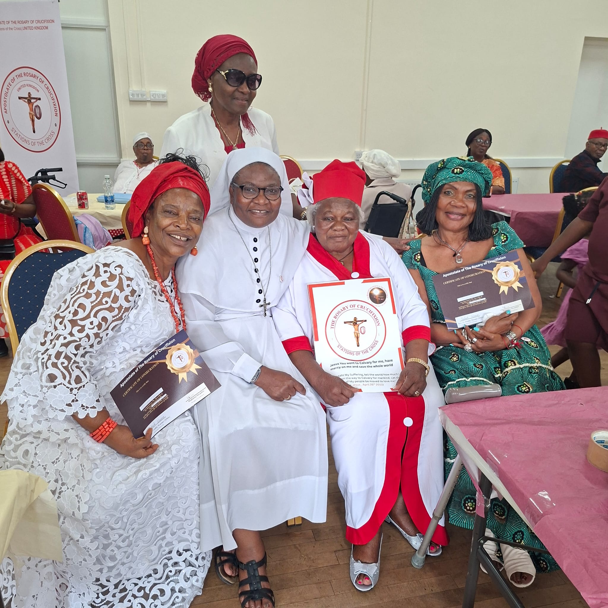 Devotees seated with consecration certificates